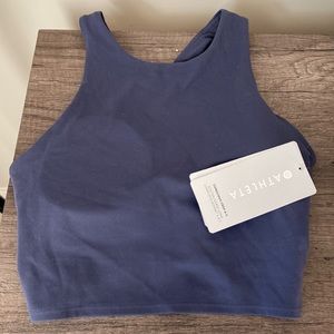 Athleta conscious crop A-C. Never worn. Dark blue/purple color. Built in pads